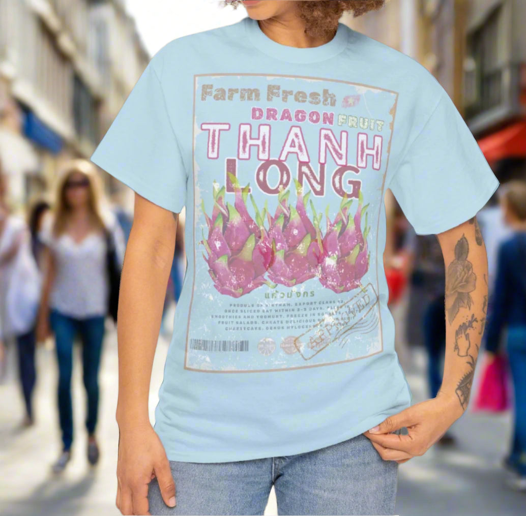 Woman wearing a light blue t-shirt with distressed,dragon fruit graphic design written in Vietnamese and English