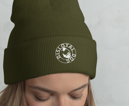 Woman wearing a green beanie with a logo against a light gray background