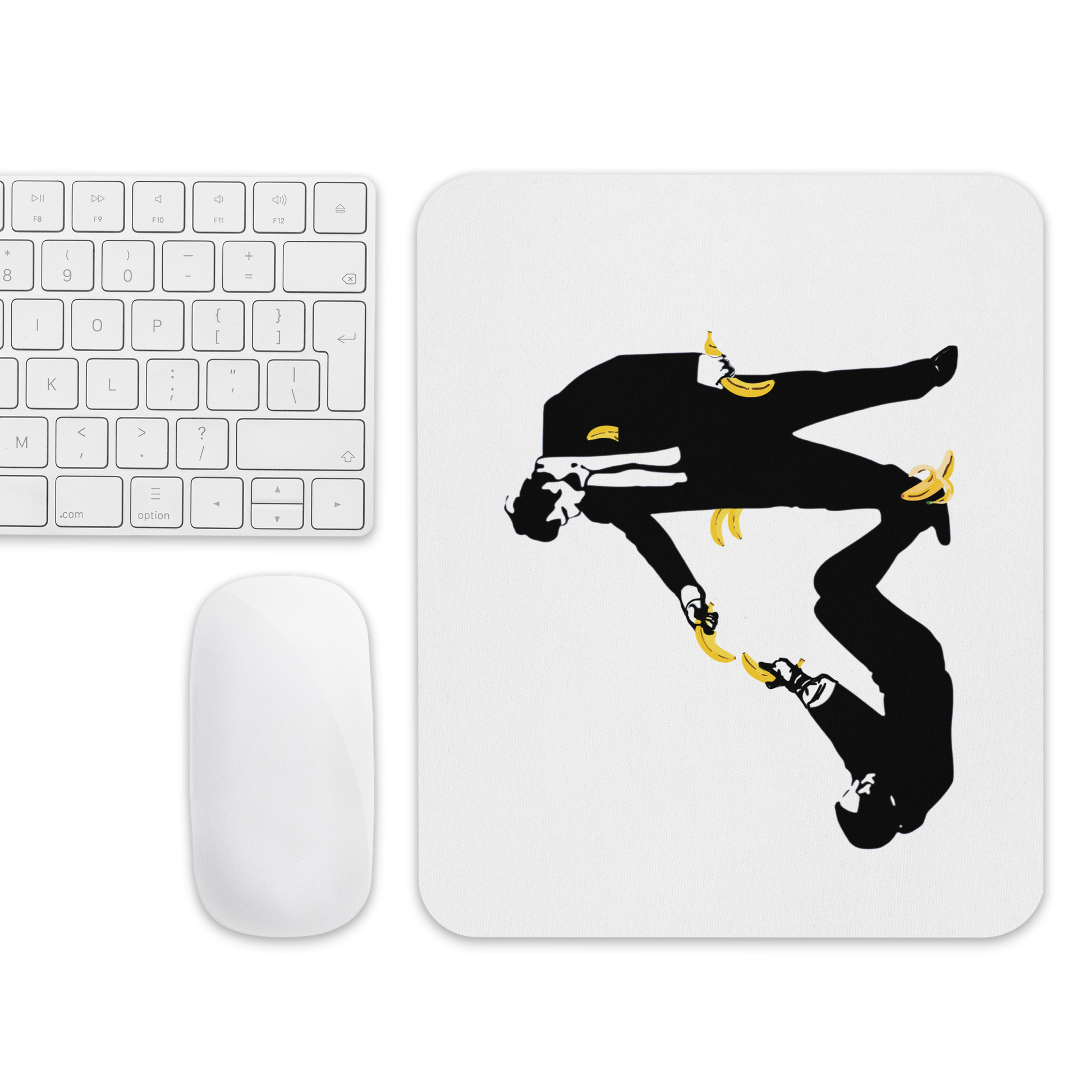 Mouse pad with a black silhouette design on a white surface next to a keyboard and mouse.
