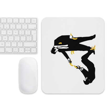 Mouse pad with a black silhouette design on a white surface next to a keyboard and mouse.